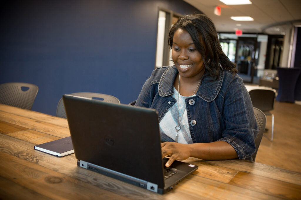 Graduate Programs Student working on laptop