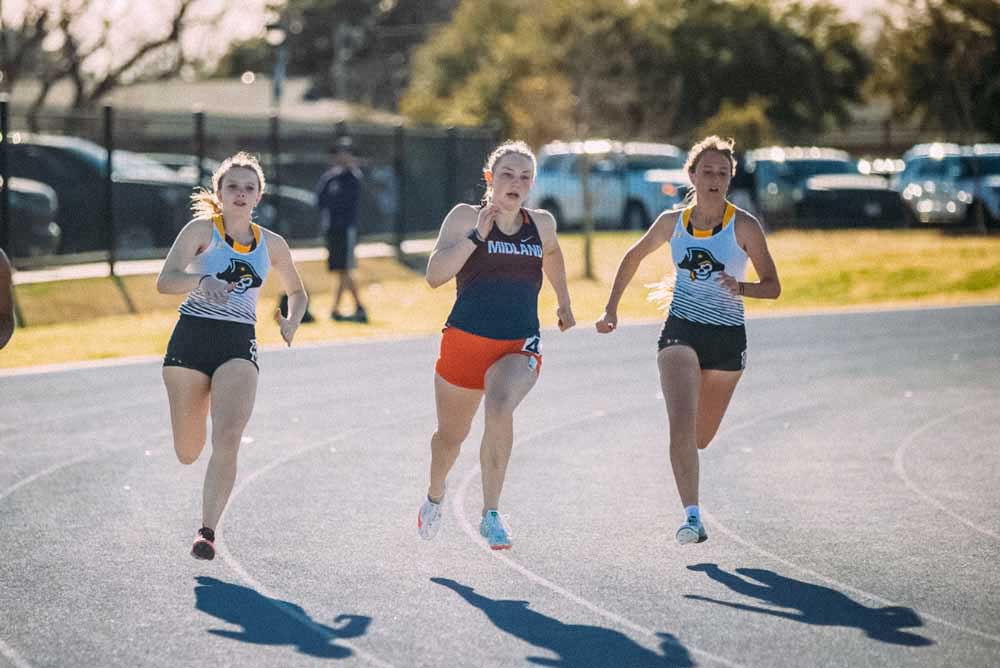 Midland University Students Running on Track